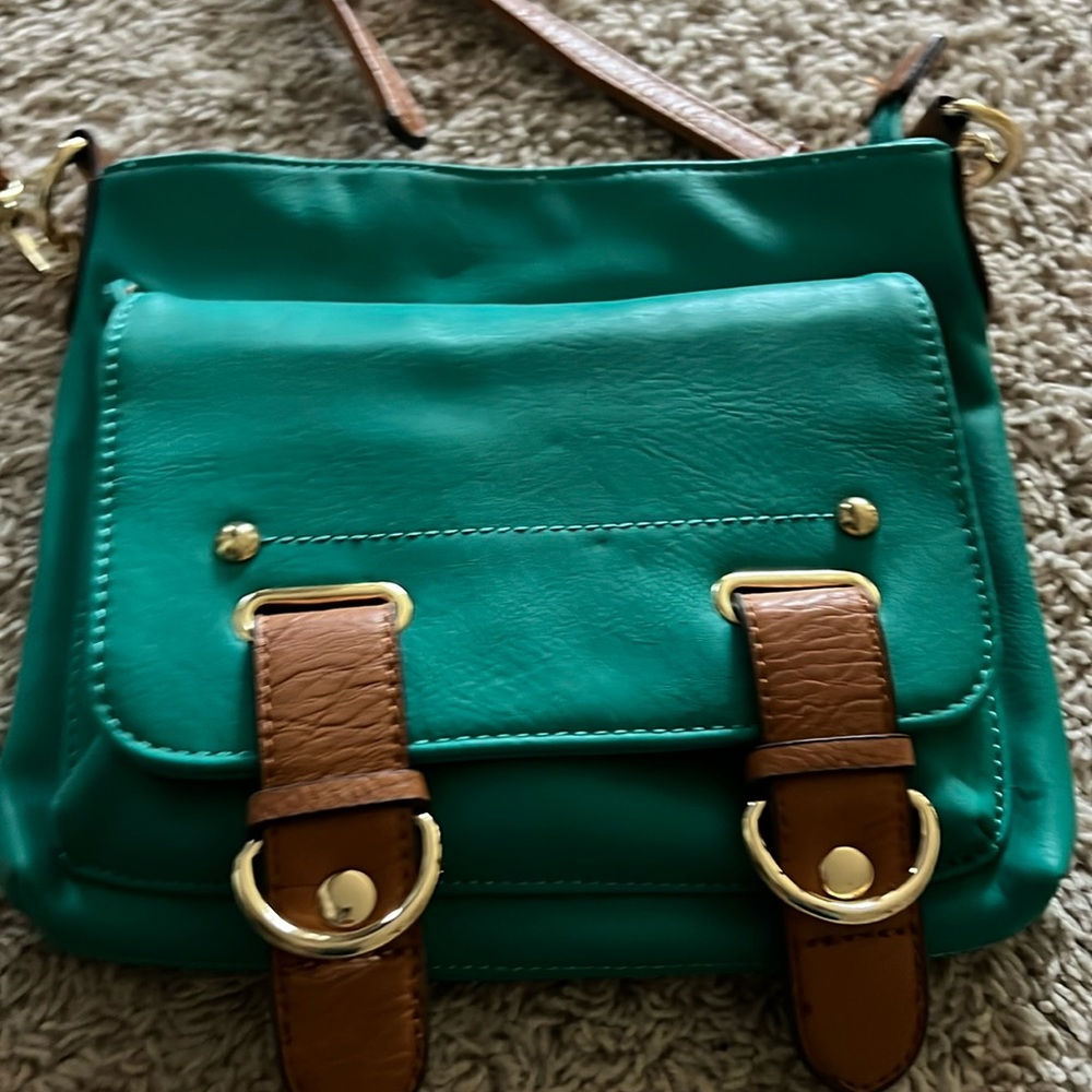 Cute teal and gold crossbody purse.